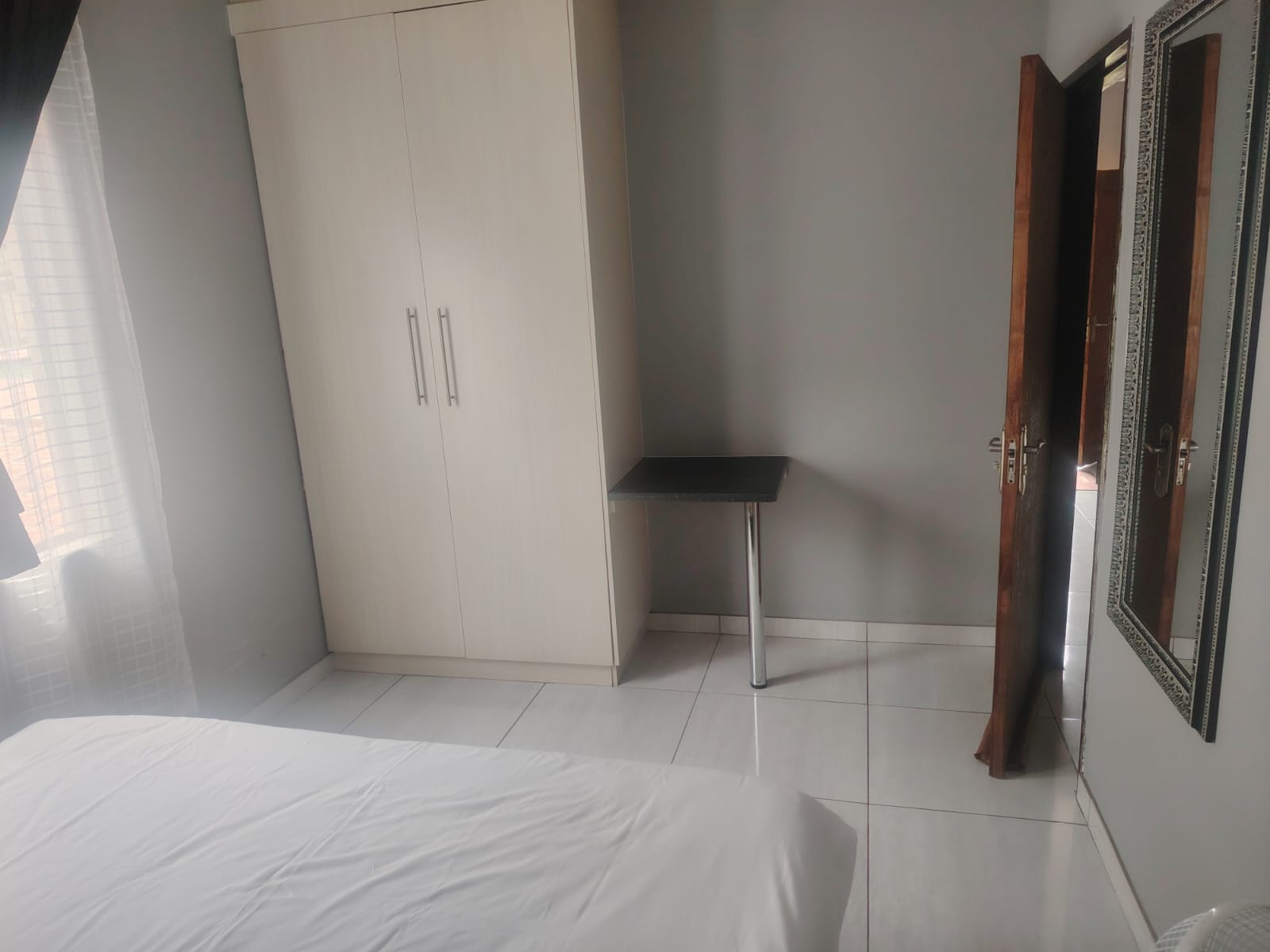 Apartment 4 bedroom wardrobe and side table